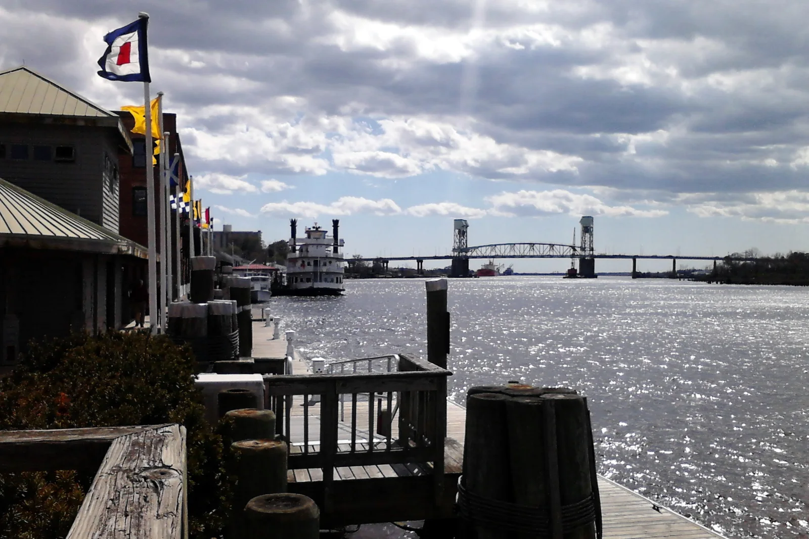 The Cape Fear River seen from Wilmington’s Riverwalk, with the Cape Fear Memorial Bridge in the distance, in March 2012.