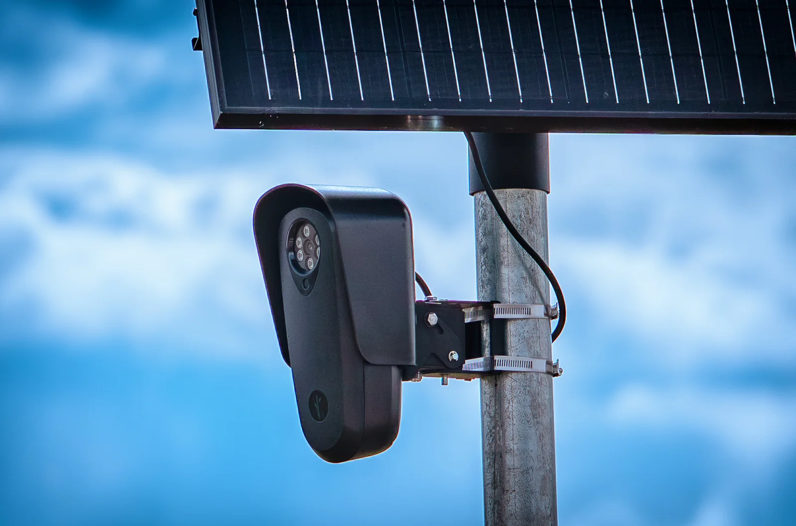 A Flock Safety license-plate reader and solar panel mounted on a pole in Jackson County, Colorado, photographed May 25, 2026.